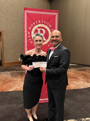 DentaQuest's Dr. Jandra Korb presents the Dean of Oklahoma University's College of Dentistry with a $25,000 donation in support of increasing access to dental care.