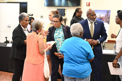 Houston Housing Authority's David A. Northern Sr. and HUD's Candace Valenzuela speak with attendees at 2100 Memorial during the launch of new housing programs, June 25, 2024. (Quincy Holmes)