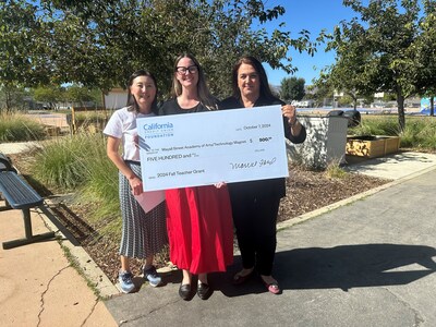 L-R: Mayall Street Academy of Arts/Technology Principal Linda Kim and Teacher Grant Recipient Laura East receive a grant check from Mariam Nasiry, California Credit Union AVP School and Community Development. The grant will be used to fund a science experiment for 3rd graders on plastic decomposition.